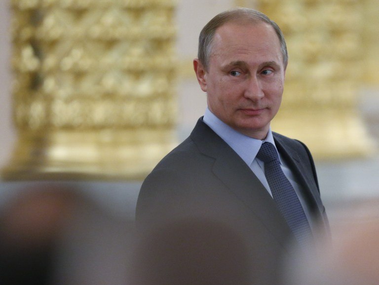 Russian President Vladimir Putin attends a session of the Civic Chamber at the Kremlin in Moscow on June 23, 2015. 