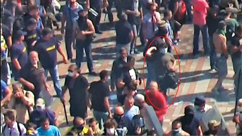 Video footage of the protest shows a man believed to be Ihor Humeniuk carrying a rucksack and wearing a mask shortly before the grenade was thrown. (Radio Svoboda)