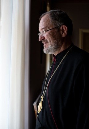 Carpatho-Rusyn Greek Catholic Bishop Milan Sasik, C.M., looks out the window of his office in Uzhgorod. 