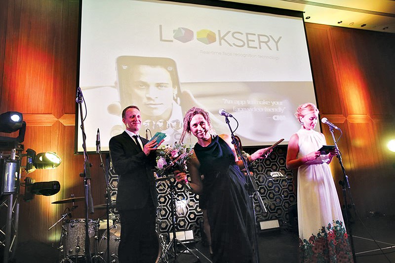 Julie Krasnienko, the marketing and business development head at Looksery (C), delivers her speech at the Kyiv Post 20th Anniversary Charity Gala in Hilton Kyiv after winning one of fi ve awards for Best Ukraine-produced Mobile Application in Kyiv on Sept