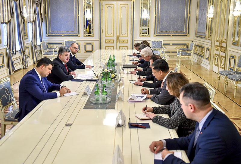 At left, parliament speaker Volodymyr Groysman, President Petro Poroshenko and Prime Minister Arseniy Yatsenyuk meet on Feb. 4 in Kyiv with the ambassadors of G7 nations. 