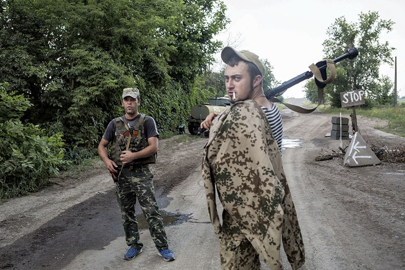 Soldiers guard the checkpoint outside Avdiyivka, Donetsk Oblast on July 11.