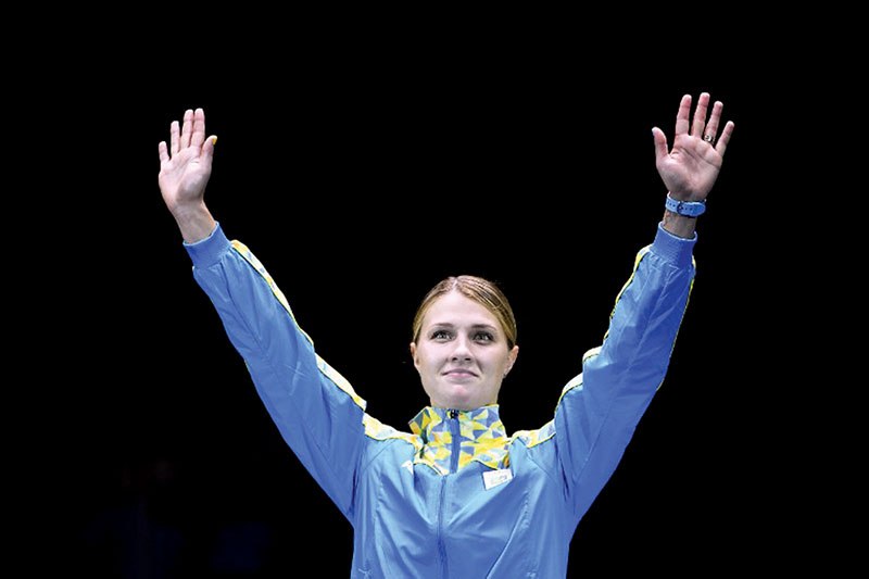 Ukraine’s Olga Kharlan on Aug. 8 celebrates her bronze medal in the women’s individual sabre fencing event.
