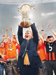 Rinat Akhmetov, the owner of Shakhtar Donetsk soccer club, holds the Ukrainian Premier League trophy, which his club won in May 2011 in Donetsk. (UNIAN)