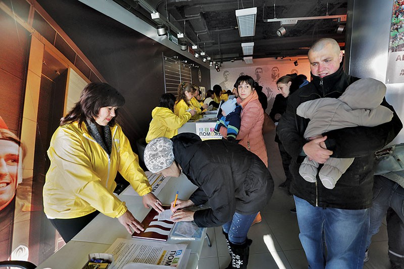 Rinat Akhmetov’s charity foundation delivers food packages to the residents of the embattled Donetsk city on Nov. 3, 2014. The food delivery was held at Donbas Arena soccer stadium, also owned by Akhmetov. (Anastasia Vlasova)