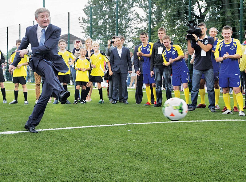 Rinat Akhmetov kicks a ball during the symbolic opening of a new soccer field at Donetsk School No 63 on Sept. 1, 2013. Akhmetov, who studied at this school, has financed it for many years. (UNIAN)