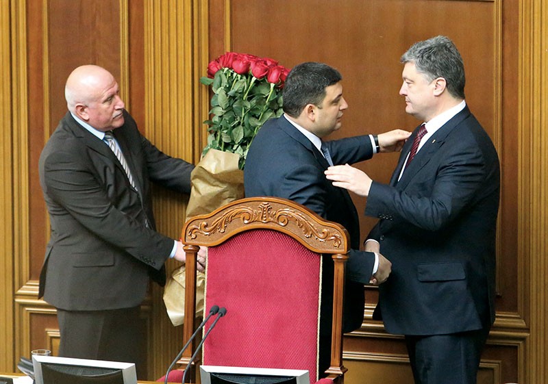 President Petro Poroshenko greets newly appointed Prime Minister Volodymyr Groysman (C) at the parliament in Kyiv on April 14. 