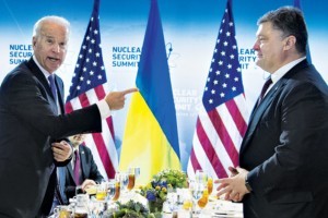 US Vice President Joe Biden (L) gestures to Ukraine President Petro Poroshenko at a bilateral meeting during the 2016 Nuclear Security Summit in Washington, DC, March 31, 2016. / AFP PHOTO / Jim Watson