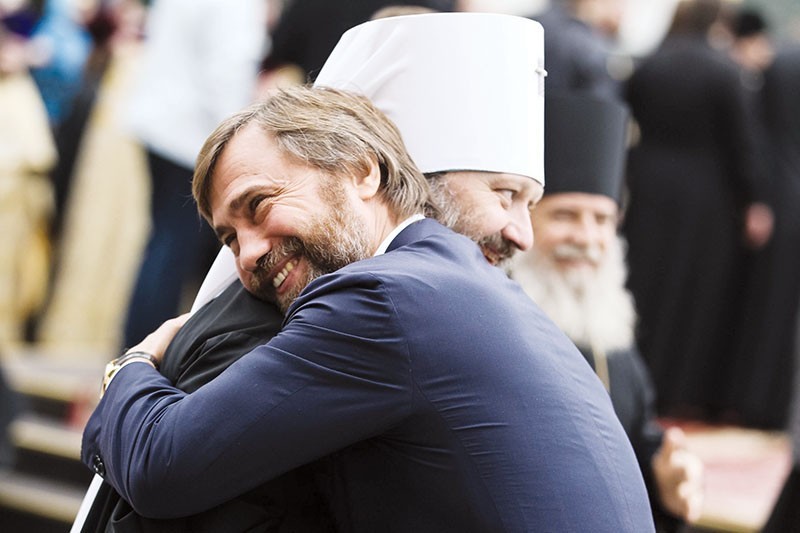 Vadim Novinsky (R) hugs archbishop Pavel, the abbot of the Kyiv Pechersk Lavra Orthodox monastery, celebrating the arrival to the monastery of the relics of St. Panteleimon from the mount of Athos in Greece on Oct. 20, 2012. (UNIAN)