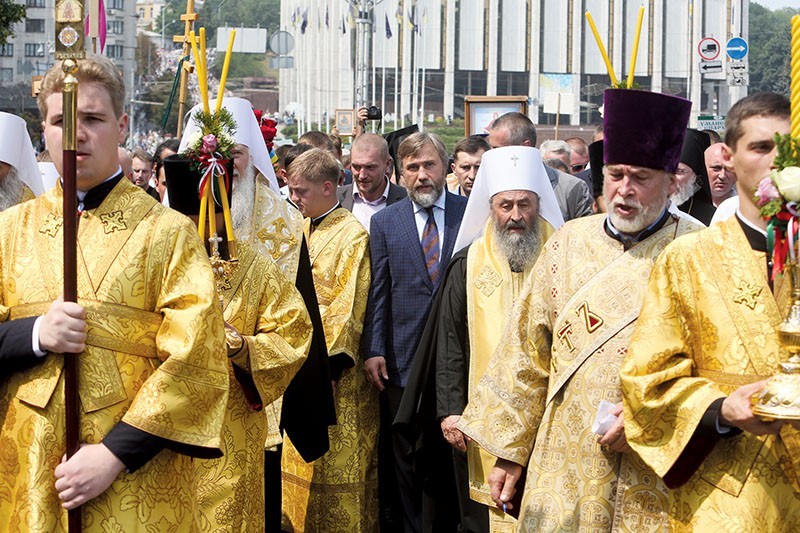 Vadim Novinsky follows metropolitan Onufriy, head of the Ukrainian Orthodox Church of Moscow Patriarchy, during a mass Orthodox pilgrimage in Kyiv on July 27. (Volodymyr Petrov)