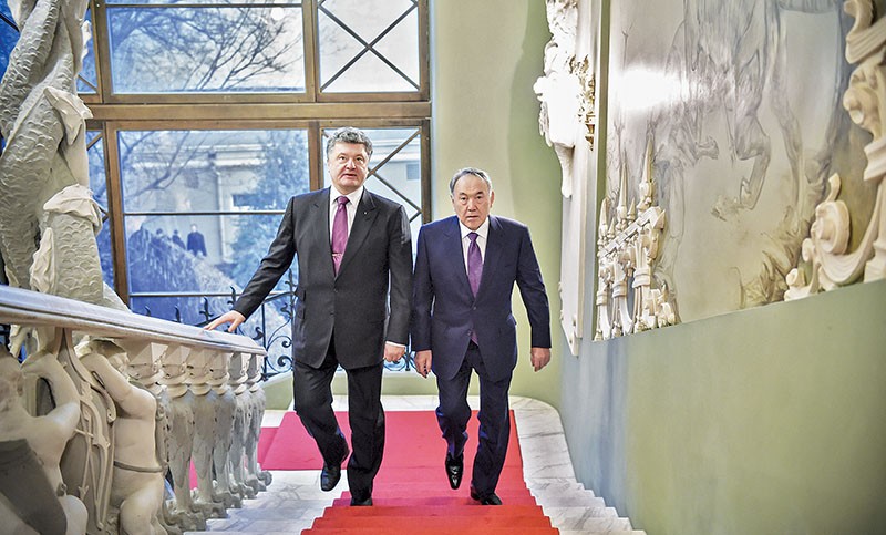 Ukrainian President Petro Poroshenko speaks with his Kazakh counterpart, Nursultan Nazarbayev, during their meeting in Kyiv on Dec. 22, 2014. Poroshenko returned the visit on Oct. 8-9, 2015, but no presidential visits took place in 2016 and none have been announced yet for 2017.