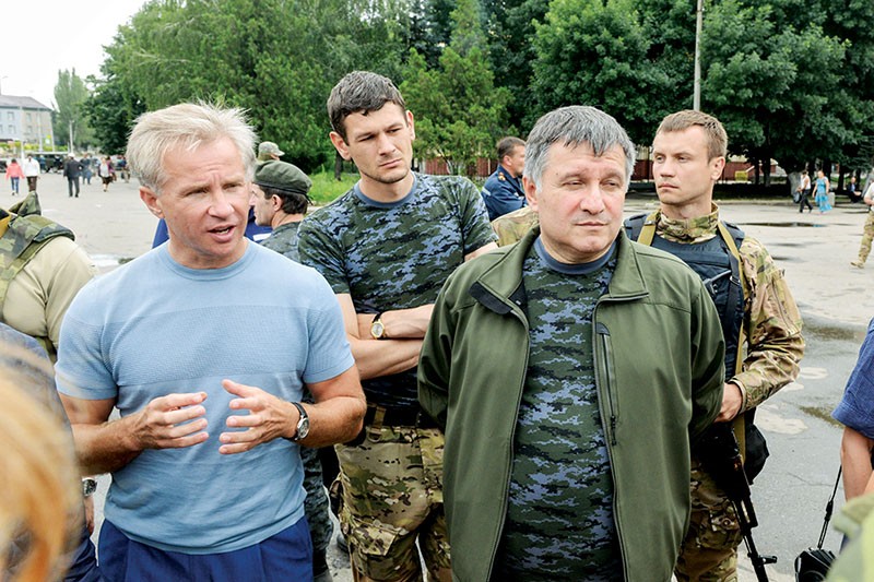 Yuriy Kosyuk and Ukraine’s Interior Minister Arsen Avakov talk to residents of Slavyansk on July 6, 2014, soon after Ukrainian army returned the city in Donetsk Oblast to the government-controlled territory.