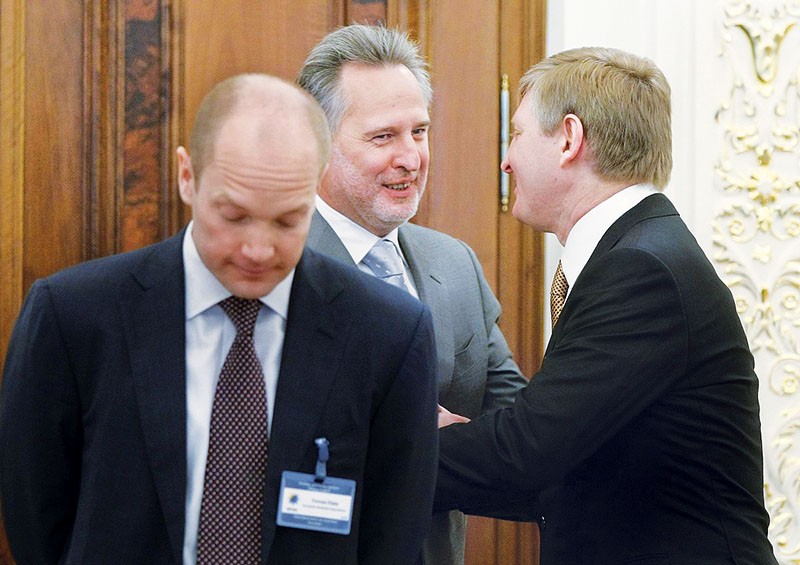 Dmytro Firtash (R) greets fellow oligarch Rinat Akhmetov. The pair have supported the defunct Party of Regions, led by overthrown President Viktor Yanukovych, and the Opposition Bloc, its replacement created after the EuroMaidan Revolution.