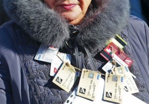 A woman with Delta Bank cards hanging on her neck attends a rally of depositors of collapsed banks in front of parliament on Nov. 15. (Volodymyr Petrov)