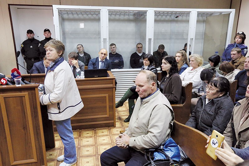 A mother of killed EuroMaidan protester testifies in Svyatoshyno District Court during the hearing of the case of former Berkut riot police officers in Kyiv on Sept. 27. (Volodymyr Petrov)