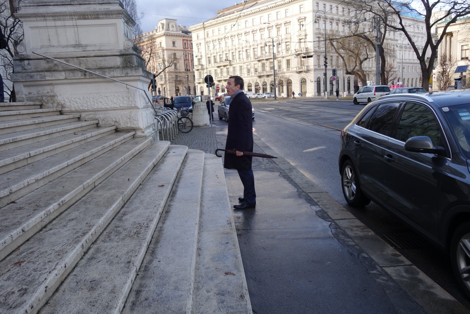 CEO of Group DF, Borys Krasnyansky, stands looking up at the courthouse moments after Austrian police arrested his boss Dmytro Firtash on Feb. 21.