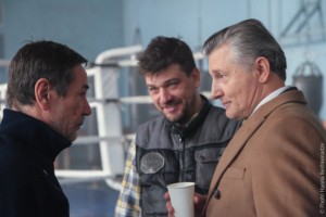 Actor Oleksiy Horbunov (L), director of the film  Oleksiy Shaparev and actor Stanislav Boklan talk backstage.