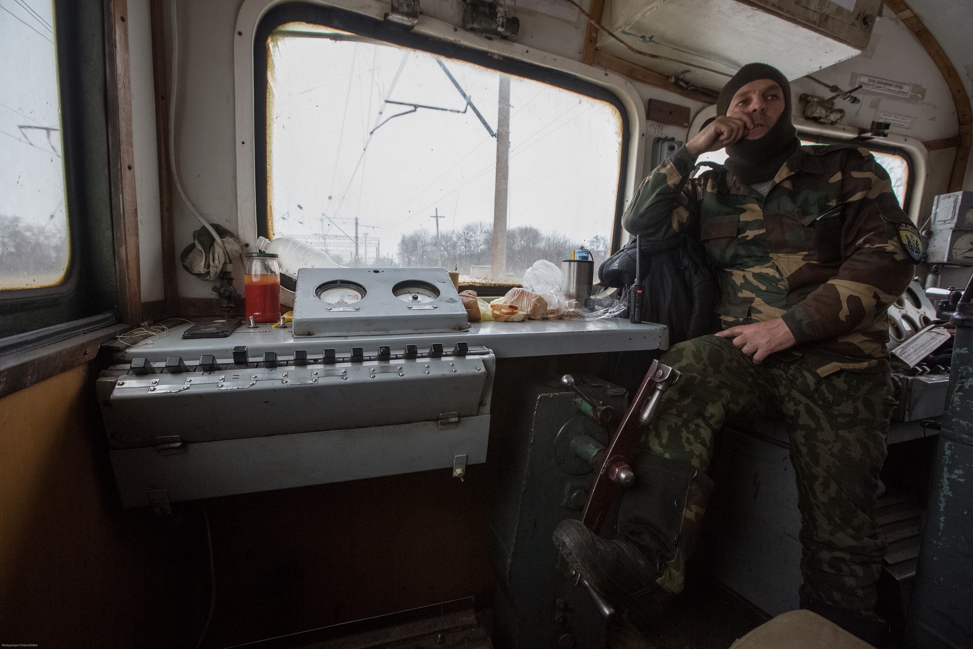 A veteran of Ukraine's ongoing war stands on duty onboard the blockaded train on Feb. 14, 2017.