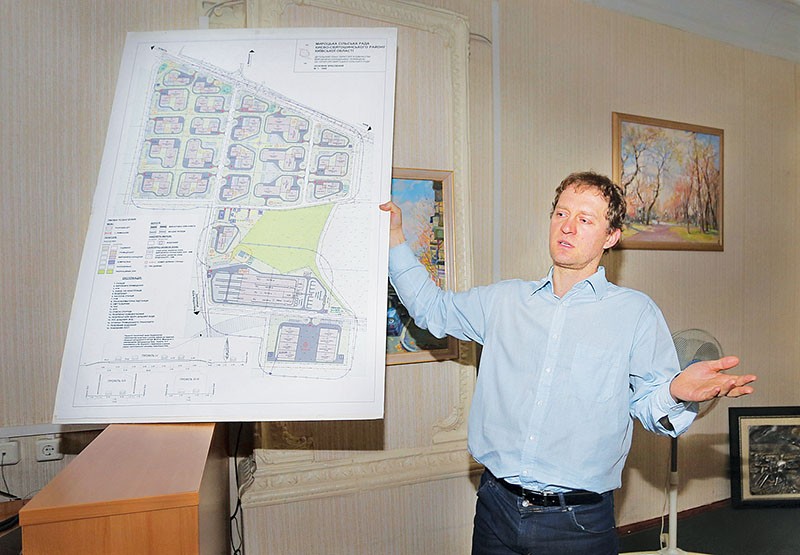 Mirotske CEO Stanislav German talks to the Kyiv Post with a blueprint of his planned industrial park on March 30 in Kyiv. 