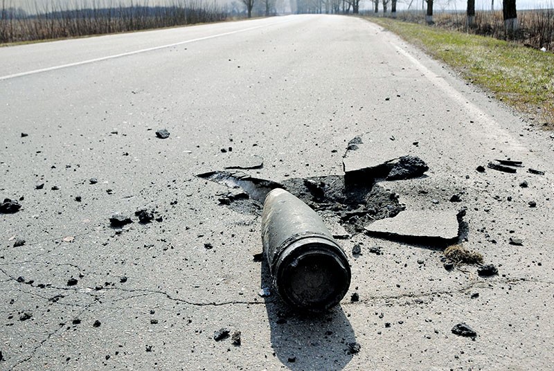 An unexploded 125 millimeter projectile struck the road to Balakliya in Kharkiv Oblast on March 23 after a massive fire of suspicious origin at Ukraine’s largest ammuntion depot. (UNIAN)