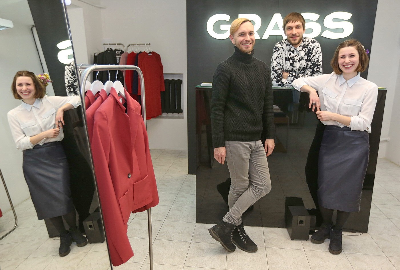Taras Volkov (L), Oleksandr Kolibabchuk (C),  and Kseniya Konstantynova opened clothing store Grass two years ago, which has since grown its following to 20,000 Facebook fans. (Kostyantyn Chernichkin)