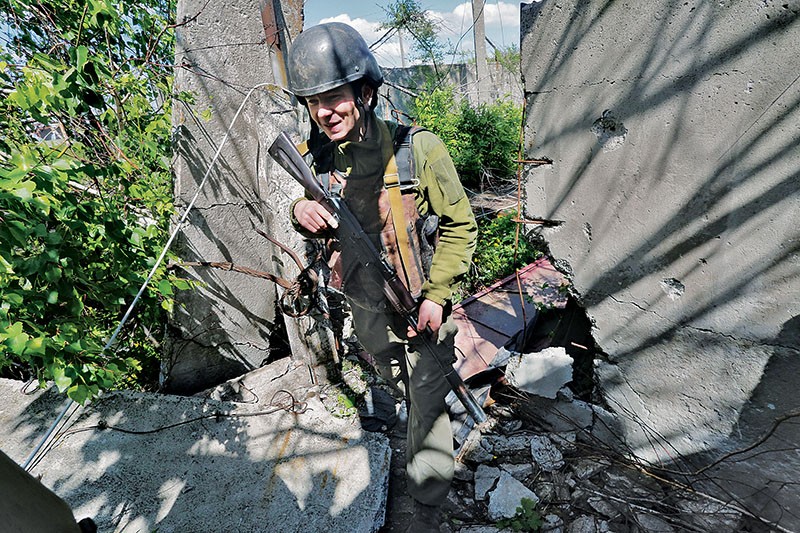 A Ukrainian serviceman goes scouting in the Avdiyivka industrial zone on May 17. (Volodymyr Petrov)