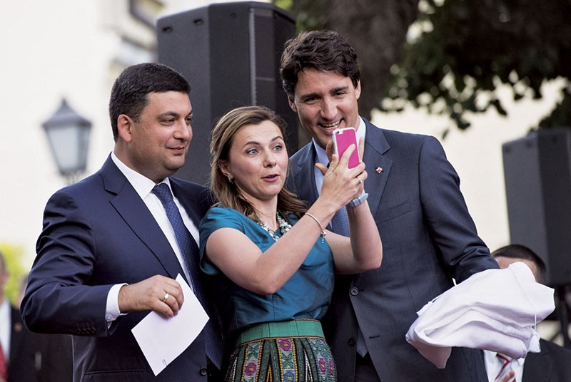 Ukraine’s Prime Minister Volodymyr Groysman and Deputy Economic Minister Nataliya Mykolska take a selfie with Canadian Prime Minister Justin Trudeau on his visit to Ukraine on July 11. (UNIAN)