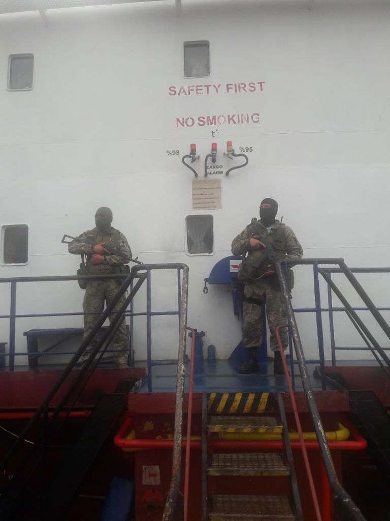 Armed officers of the Border Guard Service of Ukraine guard the deck of the Bospor vessel, detained in Odesa Oblast on June 8. (Courtesy of  dpsu.gov.ua)