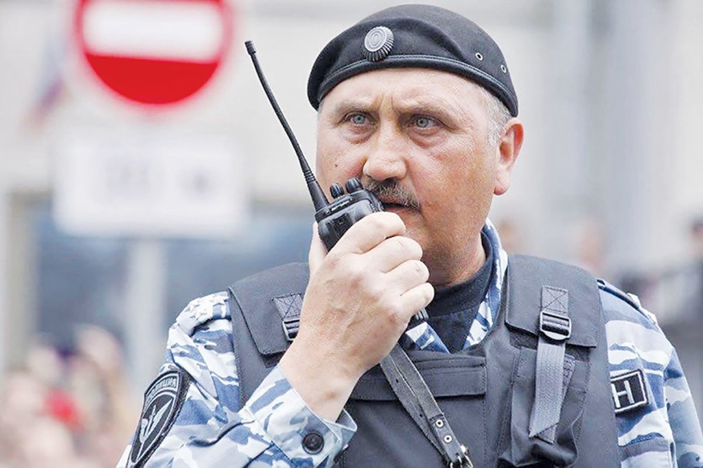 Serhiy Kusyuk, an ex-Berkut commander charged in Ukraine with ordering a crackdown on EuroMaidan protesters on Nov. 30, 2013, was filmed by Russian TV channel Dozhd (Rain) during an attack on a peaceful opposition rally in Moscow on June 12. (Maria Karpukhina/TVrain.ru)