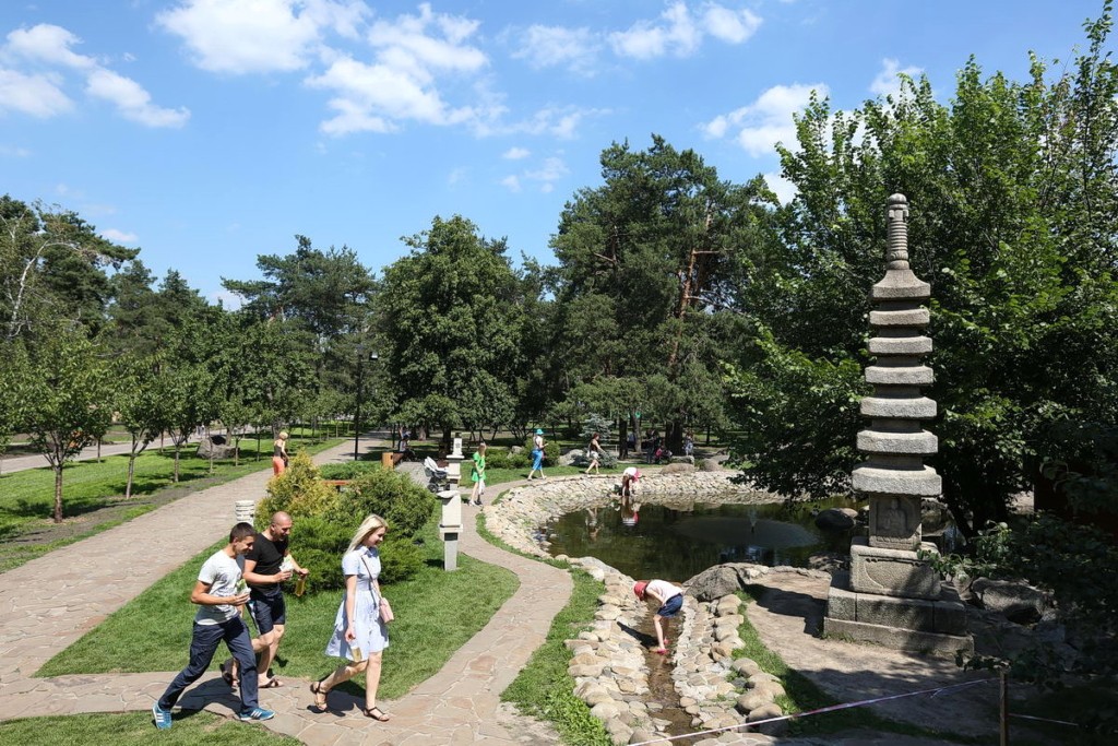 People enjoy a summer day in the Kyoto Park in Kyiv.