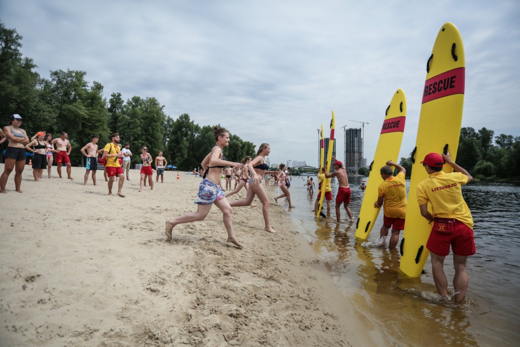 People participate in contests at Lifeguard Fest 2017, an event held by Kyiv Beach Patrol lifeguards, in Kyiv on July 1.