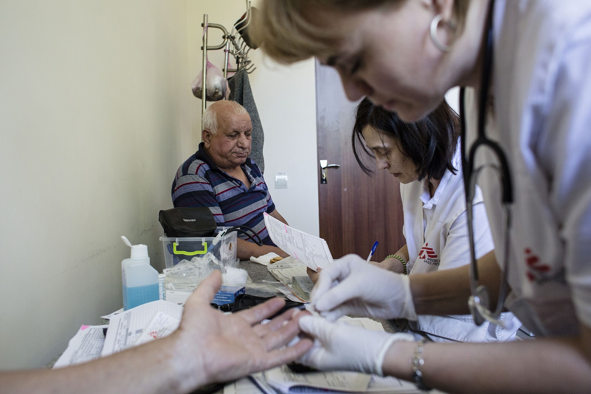Medecins Sans Frontieres, also known as Doctors Without Borders measure the sugar in blood of local residents of Kamianka.
