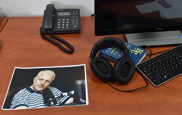 A photo of Pavel Sheremet on his desk at the Radio Vesti offices. Colleagues say his unsolved murder has made journalists in Ukraine wary. (AFP/Sergei Supinksky)