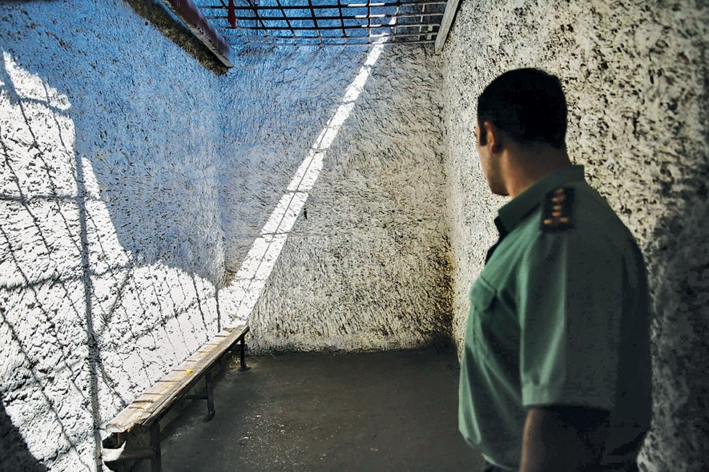 A prison guard shows a cell on the roof, where the detainees of the Lukyanivsky detention center may enjoy the fresh air, on Aug. 1. 
