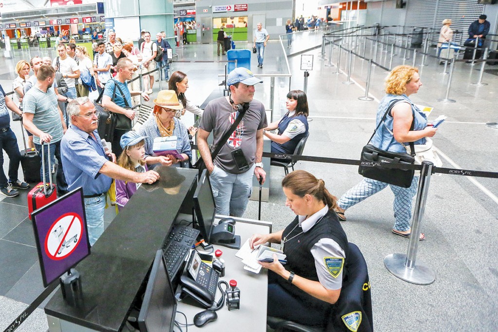 Passengers line up at passport control at Kyiv’s Boryspil International Airport on the first day of visa-free travel to the Schengen Area on June 11. 