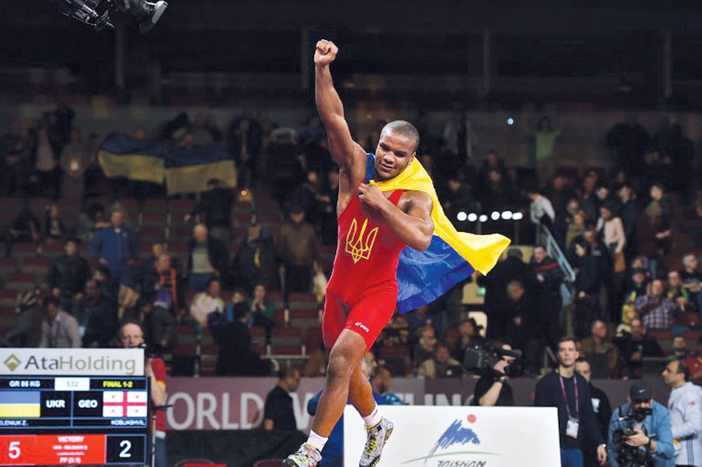 Zhan Beleniuk of Ukraine celebrate winning the 85 kg category final match at the Greco-Roman Wrestling European Championships in Riga, Latvia, on March 13, 2016. / AFP PHOTO / Ilmars Znotins