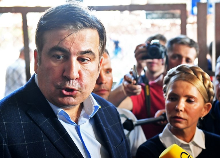Ex-Georgian President-turned-Ukrainian politician Mikheil Saakashvili and Batkivshchyna Party leader Yulia Tymoshenko talk to the press at the railway station in Przemysl, Poland, close to the Ukrainian-Polish border on Sept. 10. 