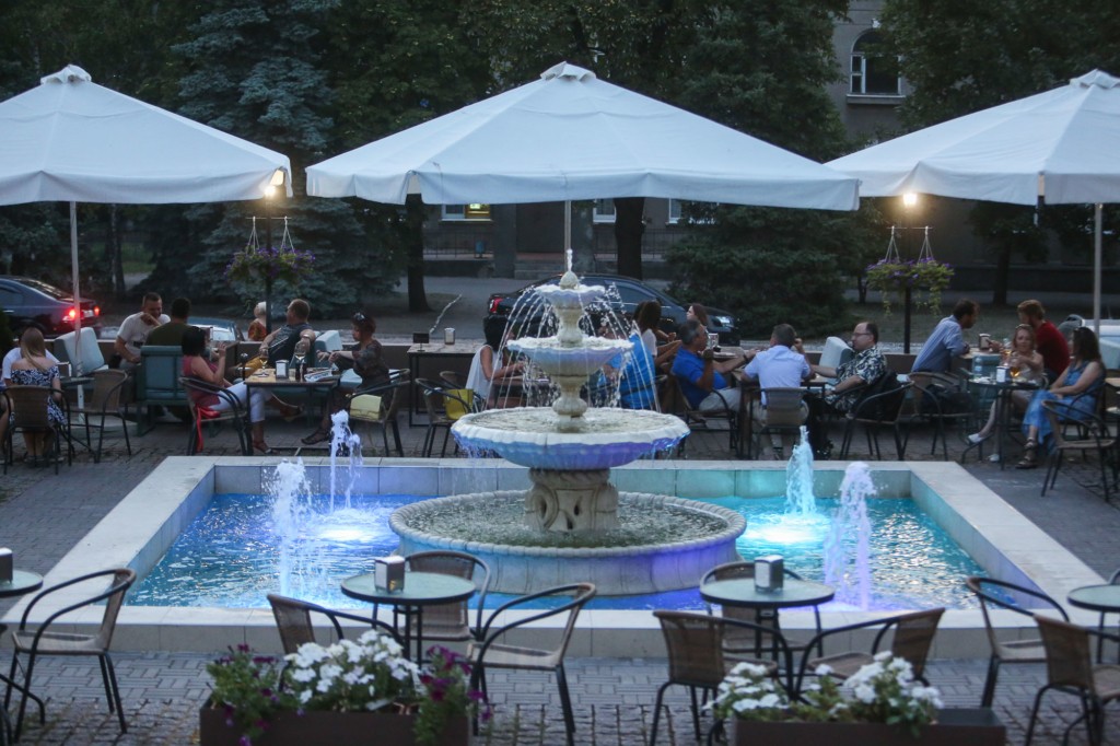 People relax at the terrace of Rodina restaurant in Kramatorsk on Aug. 14. 