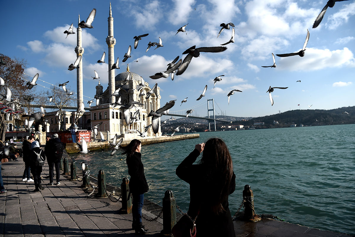 A general view taken on Jan. 2 in Istanbul shows seagulls flying near the Ortakoy Mosque by the shores of the Bosphorus Strait, the world's narrowest navigable waterway, which connects the Black Sea to the Sea of Marmara. 