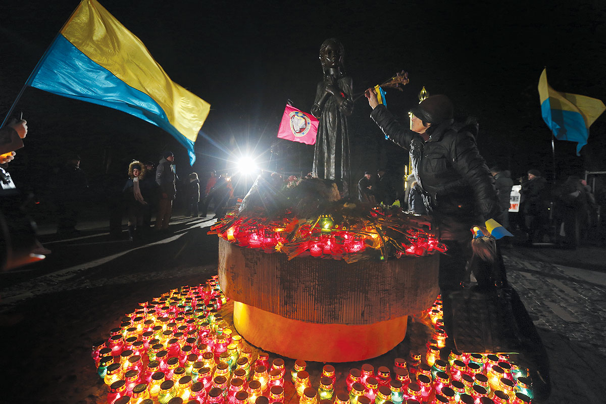 A woman pays tribute to Holodomor victims in Kyiv on Nov. 26. Ukraine commemorates the 3.9 million victmis of the Holodomor, deliberately starved to death in 1932-1933 by Soviet mass murderer Josef Stalin, on the last Saturday in November. (Volodymyr Petrov)