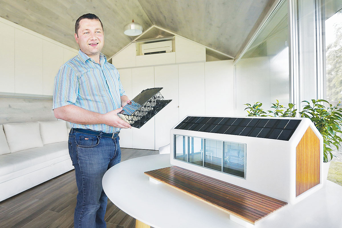 Ukrainian entrepreneur Maxim Gerbut talks to the Kyiv Post on July 13. Gerbut shows a wall sample made of carbon fiber and fiberglass and claims it is six times stronger than steel. PassivDom develops energy efficient smart homes that generate their own solar power and have in-built, off-the-grid sewage and plumbing.