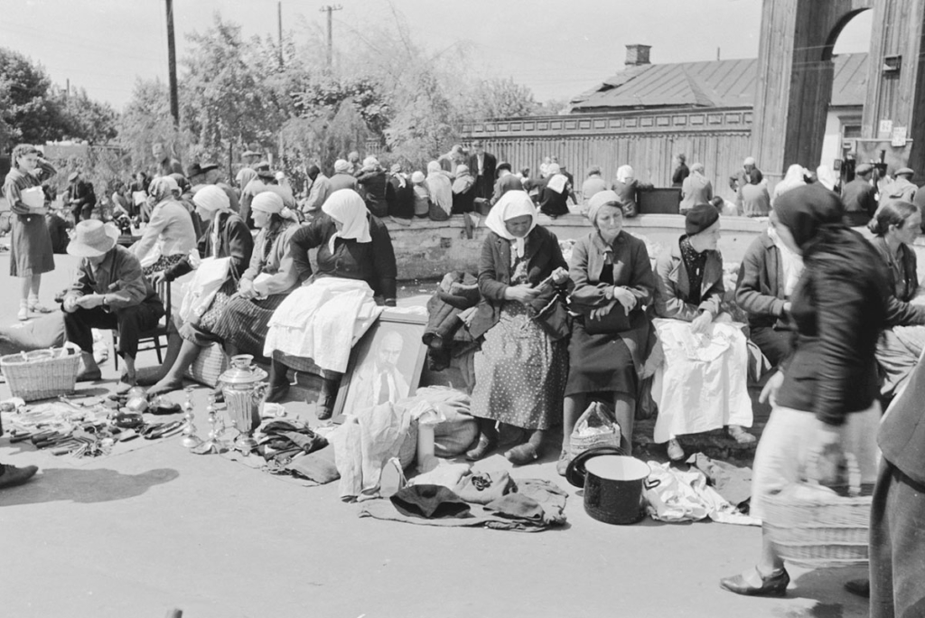 People sell food, clothes and other items at a market on the Halytska Square in Kyiv in 1942, which is now called Peremohy Square. (Courtesy)