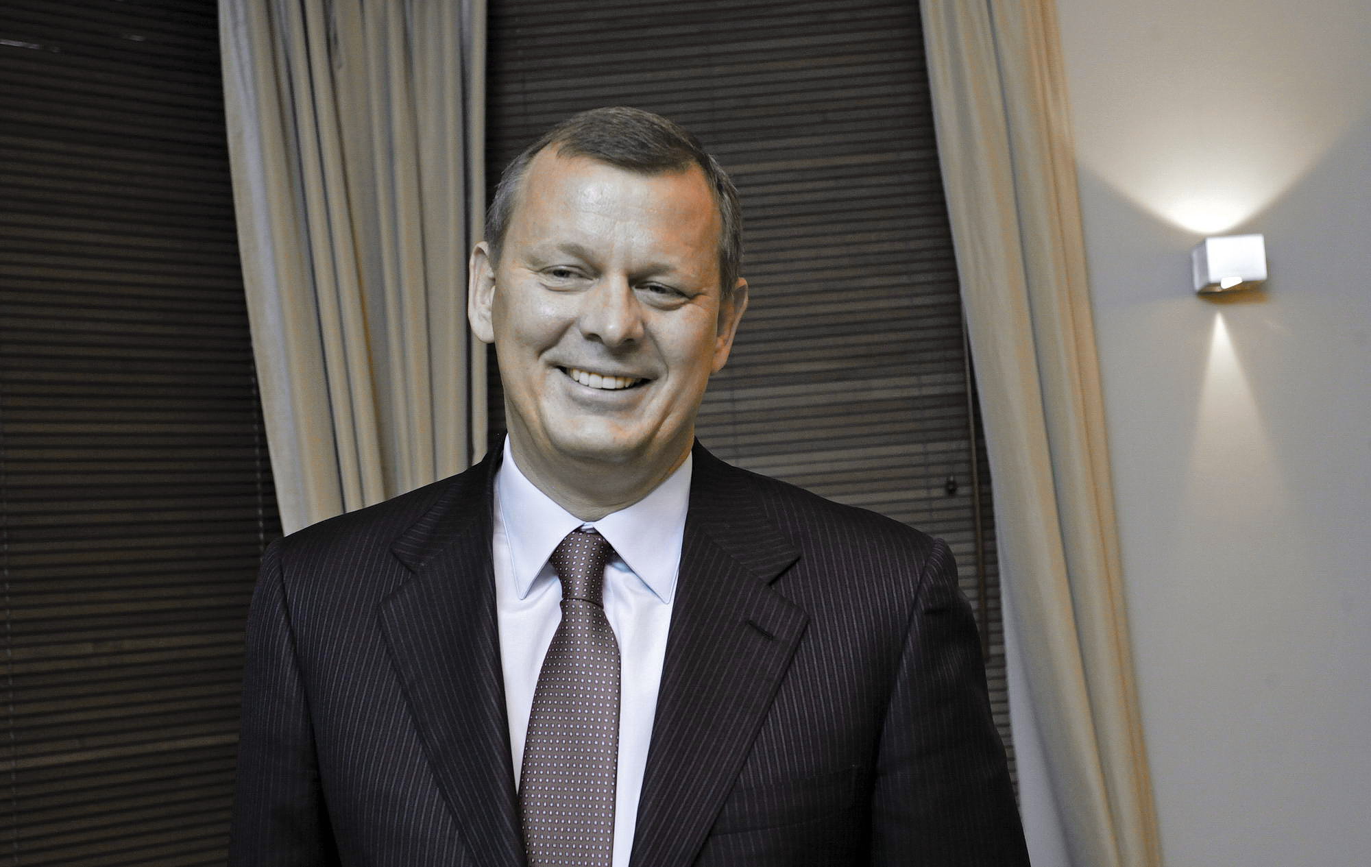 Serhiy Klyuyev grins during an interview with the Kyiv Post in Kyiv on Feb. 19, 2014. Within a month, Klyuyev would be out of Ukraine, and his Vienna-based solar company, Activ Solar, would be headed towards bankruptcy. 