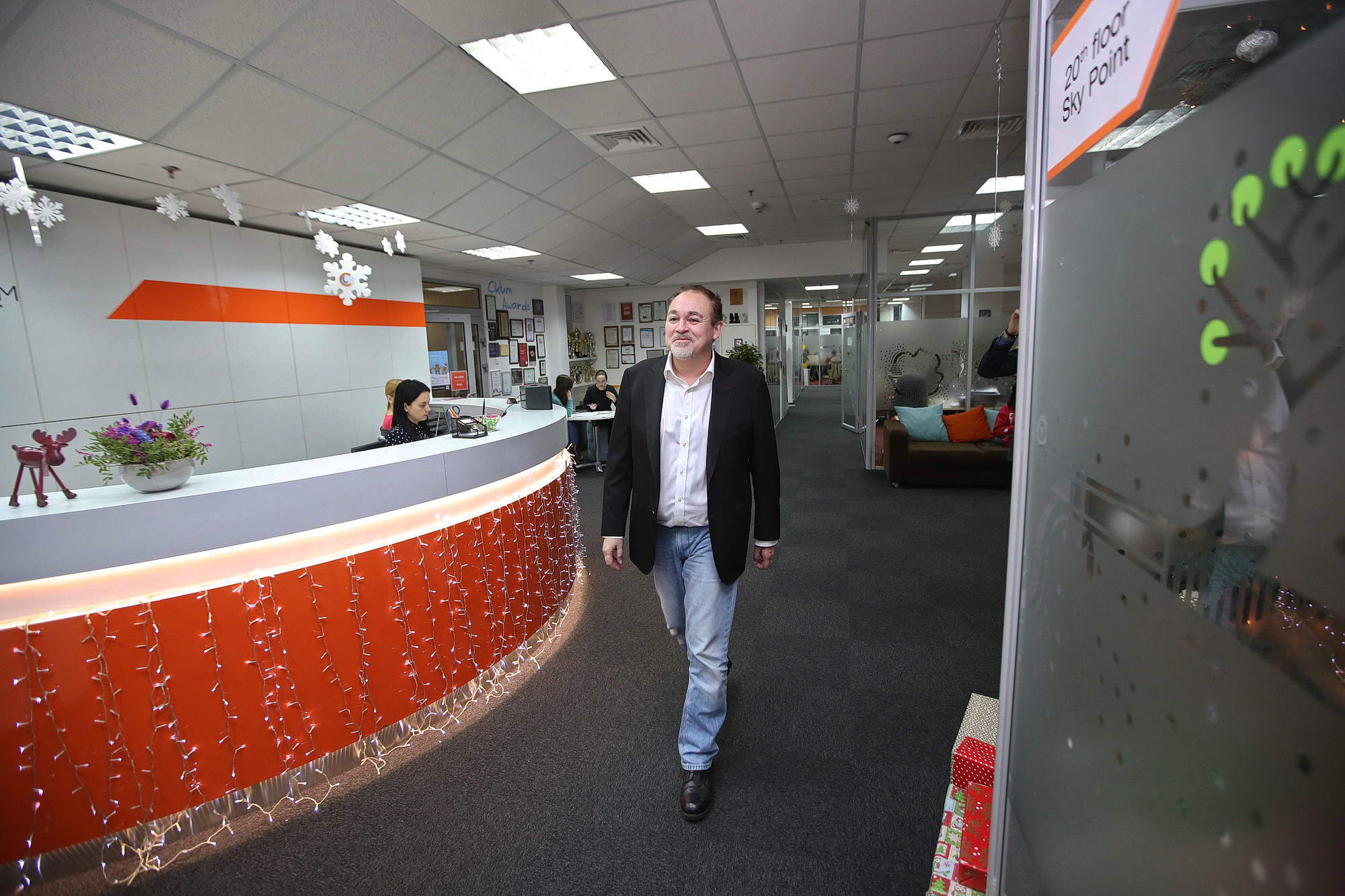 Ciklum founder Torben Majgaard walks through the main hall of the headquarter of his tech firm in Kyiv. Ciklum has six offices and 2,500 employees in Ukraine alone and 13 offices abroad, including in the United States and the United Kingdom.
