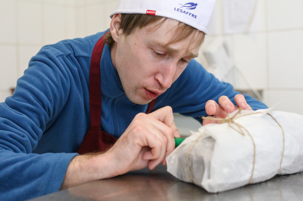 Evhen Hralchuk, a baker in Good Bread from Good People bakery, cooks pastry on Jan. 18. (Volodymyr Petrov)