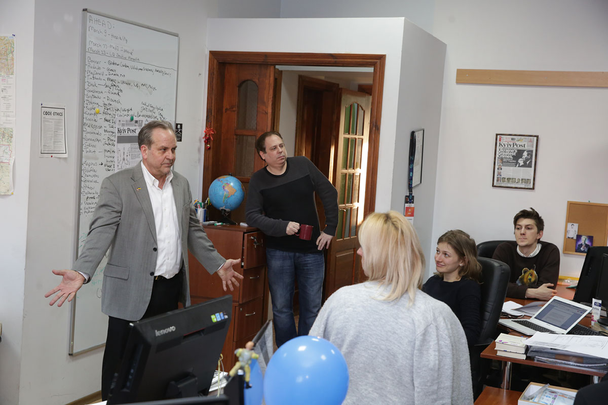 Kyiv Post chief editor Brian Bonner (L) addresses his team on March 22, a day after the newspaper was sold to the Odesa businessman Adnan Kivan. (Kostyantyn Chernichkin)